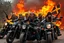 Placeholder: a very hard and tuff motorcycle young gang with viking hair, not old, posing with their Harley Davidsson bikes, some of them holding guns and shotguns, a logo sign with "FALKÖPING HD", "FEARLESS SINNERS" Skulls and bones, skeletons and fire, Sweden vikings DEMONS, Swedish flags on bikes