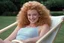 Placeholder: [snapshot from the rated movie Blame it on Ginger (1986)] 19y old ginger is blonde and curly, smiling on her all fours in the deckchair, in the garden