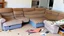 Placeholder: disassembled couch in living room