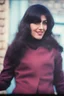 Placeholder: a woman standing in front of a brick wall, home video footage, persian rug, may 6 8, black bangs, waldo in the top right of frame, in a village street, of an beautiful girl, photo still of behind view, 1 female, old footage