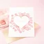 Placeholder: A photo of a white card, 5.5 by 4.25 inches. The card is vertically positioned on a beautiful light pink surface, positioned between pink rose petals and litte golden hearts.