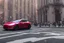 Placeholder: A Tesla 'Model S' is drifting at high speeds, near the Flatiron Building in Manhattan. (CINEMATIC, WIDE ANGLE LENS, PHOTO REAL)