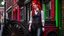Placeholder: body portrait of a woman with straight shoulder-length red hair, with metal arms and legs, dressed in leather trousers, and a waistcoat, in a Victorian street next to a steampunk carriage, full colour