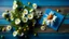 Placeholder: Garden camomile flowers bouquet and greeting card on blue wooden table. Top view flat lay with copy space