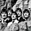 Placeholder: The faces of the Beatles on Mount Rushmore.