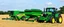 Placeholder: Parked at the edge of a field is a Claas brand Combine(left) Vaderstad Seeder(middle) and a John Deere Tractor(right) simplified