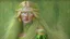 Placeholder: A woman who had green eyes and long blond hair that she wore in elaborate coiffures. Being known as someone at the height of fashion, prior to her disappearance, she favored wearing green and golden outfits to match her physical features.