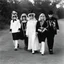 Placeholder: Elton John with girls and boys (in spooky costumes) trick or treating on Halloween. 1960s era