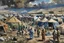 Placeholder: A painting of families in a refugee camp. In the distance there is a war going on