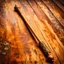 Placeholder: Closeup of an old wooden magical wand. No detailed background.Magical. Epic. Dramatic, highly detailed, realistic, hyper realistic, photo, masterpiece