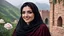 Placeholder: Hyper Realistic Close-Face-View-Of Beautiful Young Happy Pashto Woman With Beautiful-Black-Mascara-Eyes-&-Black-Hair Smiling & Wearing Black-Frock & Black-Shawl-With-Maroon-Lace Carrying A White-Rose outside a brick-castle-wall on Mountain-Top With Greenery & Breathtaking Cloudy-Rainy-Weather Showing Dramatic & Cinematic Ambiance.