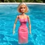 Placeholder: old barbie doll in a swimming pool
