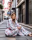 Placeholder: a supermodel in designer sleepwear sitting on street for magazine cover photoshoot