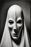 Placeholder: a black and white photograph in the style of man ray, the photograph is of a scary ghost mask