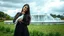 Placeholder: Hyper Realistic Photographic View Of A Beautiful Young Pakistani Pashto Woman (With Beautiful Long Black Hair) Wearing A Beautiful Black Dress Happily Holding A White Pigeon And Standing With Green Grass With A White Marble Water Fountain Behind Her At Beautiful Cloudy Day Showing Dramatic And Cinematic Ambiance.