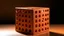 Placeholder: Un gran cubo de color terracota perforado por huecos profundos y regulares, algunas aberturas dejan ver espacios interiores vacíos, fachada frontal que enfatiza la geometría pura del objeto arquitectónico, sombras suaves que marcan cada perforación, ambiente de extrañeza y sofisticación escultórica