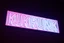 Placeholder: A 1980 disco sign labeled "KUKRUNK" white background and bold 80s font