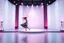 Placeholder: A 3D recursive structure modern stage with a pretty lady in modern clothing dancing,animating background stage