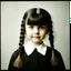 Placeholder: wednesday addams as a child, braids, frange, , worn autochrome, 1970s, wierd atmosphere, sad