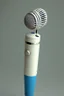 Placeholder: White gold portable singing microphone containing a blue gem Photorealistic