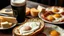 Placeholder: A glass of Guinness stout, a platter of cheeses, a chunk of freshly baked bread with butter and sliced ham, fried eggs. Award-winning colour photograph.