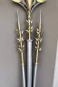 Placeholder: A large silver and Gold holy spear weapon covered in rose's and thorns, realistic, fantasy,