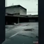 Placeholder: Minimal abstract oil paintings of a desolate concrete 1960s carpark. Road with distant Blurry lights. On the floor are concrete fragments and road markings . In the dark mysterious style of Justin Mortimer and Francis Bacon.