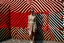 Placeholder: Front profile full body photography, in font of a rusty billboard, a hip hop 80's british model woman with 50's haircut, in a white and red zig zag stripes turtleneck dress and large sunglasses, 80 degree view, art by sergio lopez, natalie shau, james jean and salvador dali