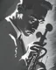 Placeholder: A dynamic portrait of a jazz musician, immersed in the act of playing their instrument, in the style of chiaroscuro, high contrast between light and shadow, bold lines, and a sense of movement, inspired by the works of Caravaggio and Frank Miller, capturing the passion and energy of live performance.