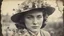 Placeholder: Vintage photograph of a woman in a hat with flowers, torn edges, cracks