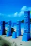 Placeholder: A blue beach with Hawaiian tikis painted by Andy Warhol