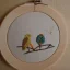 Placeholder: exquisite whimsical birds in embroidery hoop, intricate, highly detailed, linen and wood backdrop