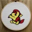 Placeholder: exquisite whimsical pikachu in embroidery hoop, intricate, highly detailed, linen and wood backdrop