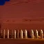 Placeholder: Many simulsats standing in line in front of an ancient statue in Sahara at night by Chris moss
