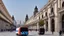 Placeholder: A police Tesla Cybertruck is chasing a Tesla 'Model S Plaid' at top speed, across the 'Plaza de la Constitución', in the city of Mexico. CINEMATIC. WIDE ANGLE LENS. PHOTO REAL.