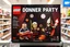 Placeholder: Lego box displayed for sale on a store shelf with the Lego brand Logo in the top left corner. Text: "DONNER PARTY" for the exact text title of the box across the top in a vibrant bold clear font. Add graphics for Age Range with random age ranges. Images on the box are extremely satirical darkly sinister creations importantly all made of individual legos with pronounced well-defined lego raised pip textures on all surfaces! Box images are extremely clever and sardonically inventive based on 1880