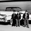 Placeholder: a 50s Greaser BAND standing in front of a hot rod