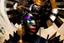 Placeholder: a close up of an arafed black woman with a rusty scrap metal headgear, engulfed in fragments of a spiral marble staircase, art deco vibe, stylized photo, japanese popsurrealism, afrofuturism, amazing reflections, geisha mask influence, eyeslit visor fear, tang dynasty influence, war paint face, elaborate haunted face, neotokyo source, warm saturated colors, futuristic cloning facility, sudden juxtapositions, arafed inlars supportive