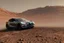 Placeholder: A Tesla 'Model Y' is racing at top speed, at the Cydonia region on Mars. (CINEMATIC, WIDE ANGLE LENS, PHOTO REAL)