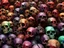 Placeholder: a picture of a dark, comedic, anatomically correct wall of colorful tightly packed stacked cyborg skulls of varying sizes and expressions, photo realistic, insanely meticulous, highly detailed, part of a collection of bones on display, 64k, dystopian, vray