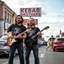 Placeholder: 3 swedish Jesus like men in a rockband standing on a busy street wearing a t-shirt and instruments. a kebab brothers t shirt, with a kebab brothers logo, KEBAB BROTHERS tattoo in forehead, KEBAB BROTHERS Sign in background, Kebab brothers store, Kebab Brothers sign on cars, Kebab Brothers cloud in the sky