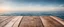 Placeholder: Wooden table on the background of the sea