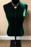 Placeholder: dark green velvet Necklace Mannequin Stand on a luxury table