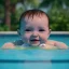 Placeholder: Cute Baby swimming in pool unreal 5, octane render,cinema4d, dynamic lighting, dramatic lighting, 4k, redshift render, highly, hyperrealism detailed, hyper realistic.