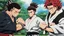 Placeholder: yujiro hanma vs yoriichi tsugukuni, baki vs kimetsu no yaiba, two mans standing in front of each other, a big strong man in black shirt with red hair and evil grin in martial art's stance with bare fists facing a smaller feminine swordsman with long hair and calm face reaching for his sword in traditional japanese clothes both preparing to fight each other