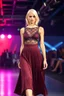 Placeholder: A fashion model with breasts and sleek, platinum blonde hair confidently walks a dimly lit runway in an avant-garde dark red midi pleated skirt and a sheer lace top with shimmering lace overlay, captured from a low-angle perspective that emphasizes her commanding stature, with a blurred audience in a professional setting, animated color lights casting a futuristic ambiance, radiating a strong physical presence body physics,at the end she stops with nice pose.
