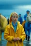 Placeholder: In the music video, a 23-year-old woman with blonde hair and bright blue eyes stands in the sea, se has a bun. dressed in a yellow fisherman's jacket ag. She holds an umbrella, but it offers no protection from the pouring rain. Around her, heavy horses are moving. The rain is pouring heavily. She is standing in the middle of the sea. You can see here completely. Horses only the girl and horses, i wanna see the horses dancing around her.. NOT SEXY!! middle of the sea, green pants, bolder, green