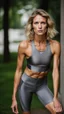 Placeholder: photography of a beautiful anorexic woman, grey satin triathlon top, sports illustrated, blond short wavy bob haircut, pronounced sternum, flat chest, anthracite cycling leggins