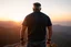 Placeholder: a brawny man with grey hair views sunset from a cliff