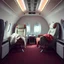 Placeholder: two armchairs in a plane, with blankets, retro futuristic